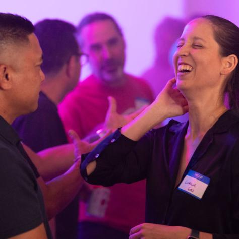 Candid photo of woman laughing. 