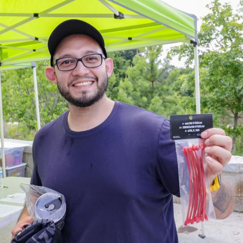 Man posing with zip ties. 