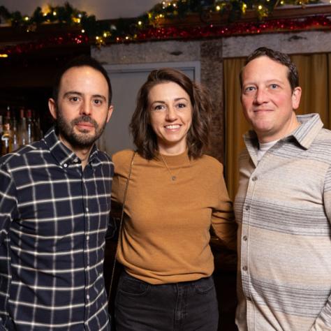 Three people posing for photo.