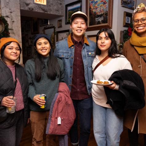 Group of people posing for photo. 