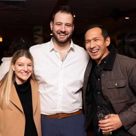 Three people posing for photo.