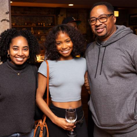 Three people posing for photo.