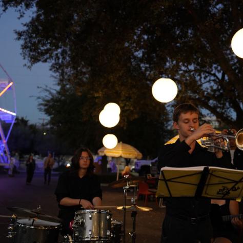 Photo of man playing trumpet. 