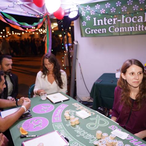 Photo of people playing cards. 