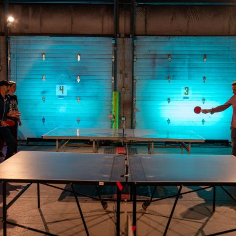 People playing ping pong. 