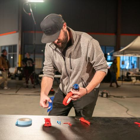 Man working with tape. 