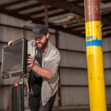 Man working on screen. 