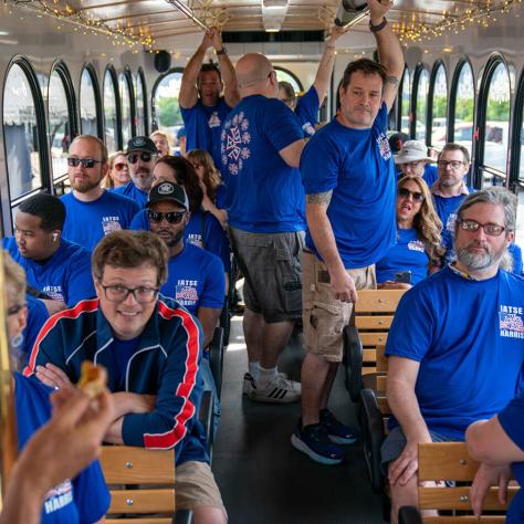 People riding a trolly. 