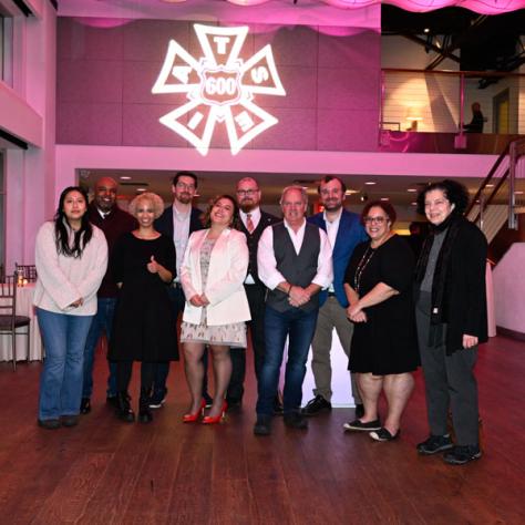 Group of people posing for photo.