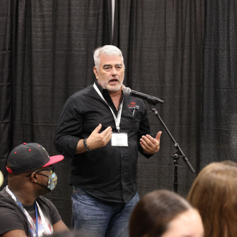 Man speaking into microphone. 