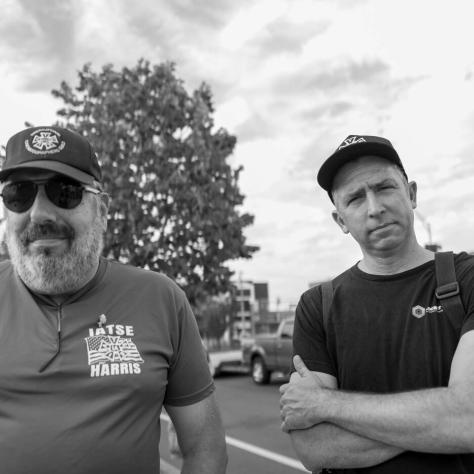 Two men posing, black and white photo. 