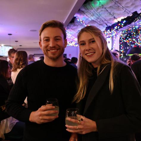 Two people posing for photo. 