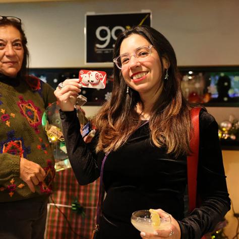 Two women posing for photo. 