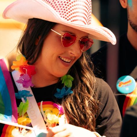 Candid photo of woman in cowboy hat. 