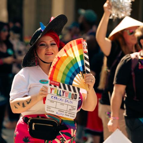 Woman marching in parade. 