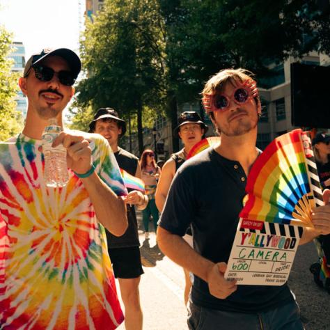 Two men in pride parade. 