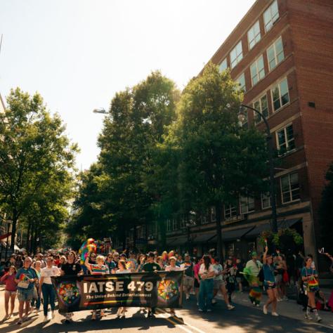 Photo of people marching in parade. 