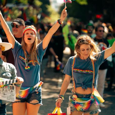 Women cheering in parade. 