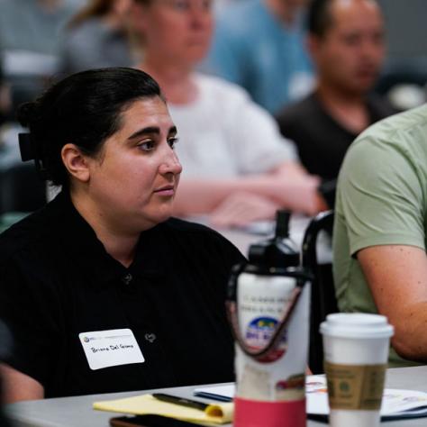 Woman watching presentation. 