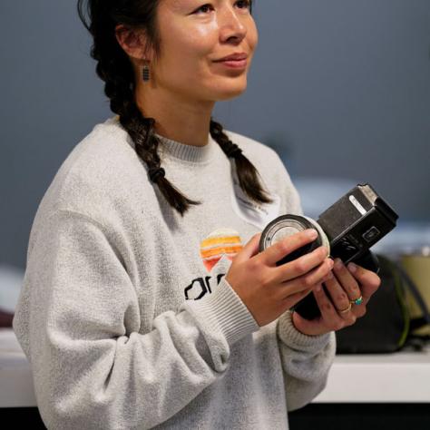 Candid photo of woman standing. 