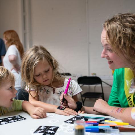 Woman working with kids. 