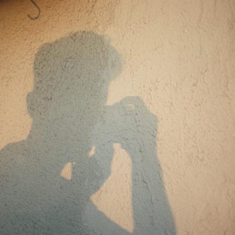 Shadowed figure of an unemployed still photographer.