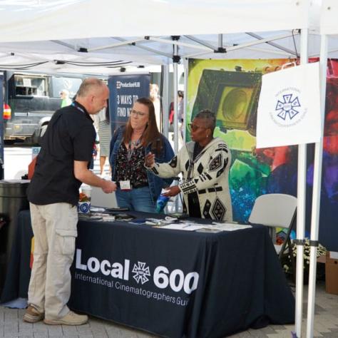 Person at Local 600 booth. 