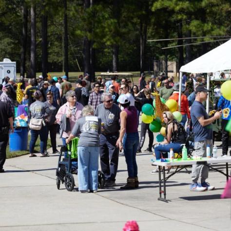 People outside at field day event. 