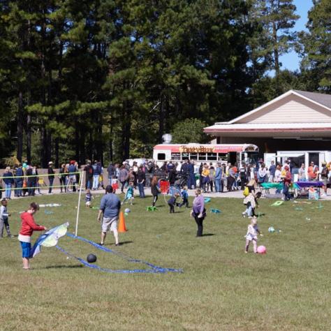 People playing games on field. 