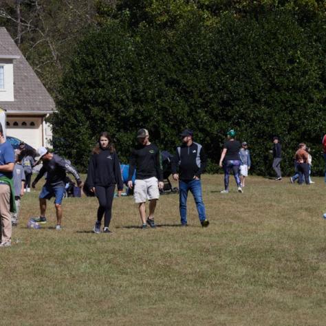 People on field at event. 