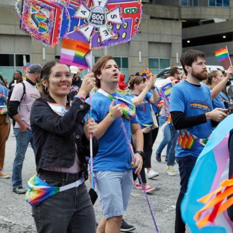 People marching in pride parade. 