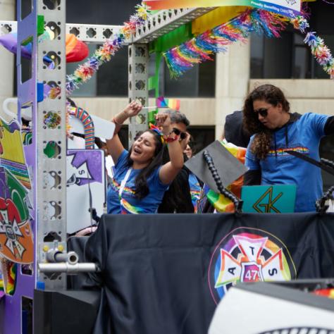 People dancing on float. 