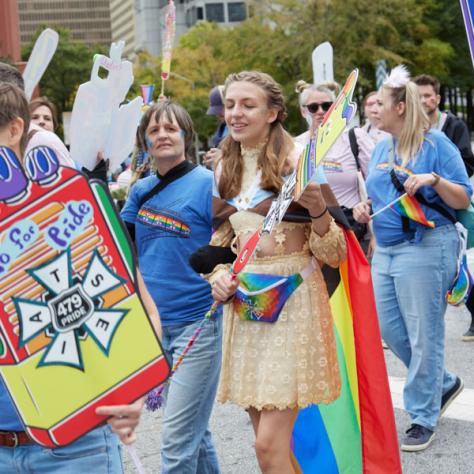 People marching in pride parade. 