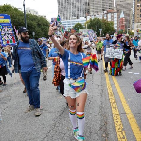 People marching in pride parade. 