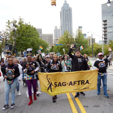 People marching in pride parade. 