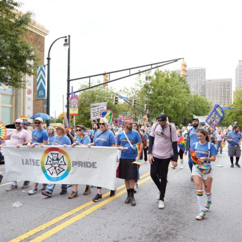 People marching in pride parade. 