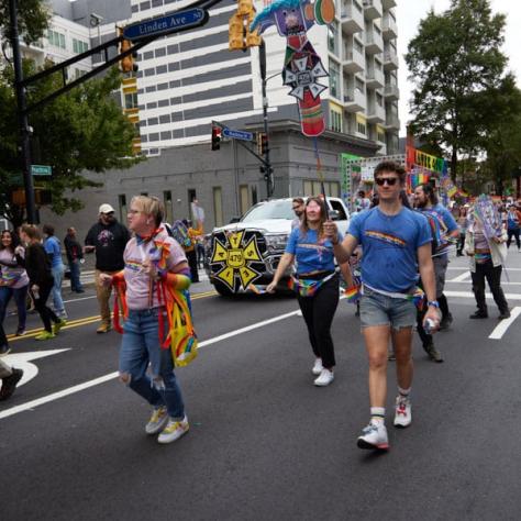 People marching in pride parade. 