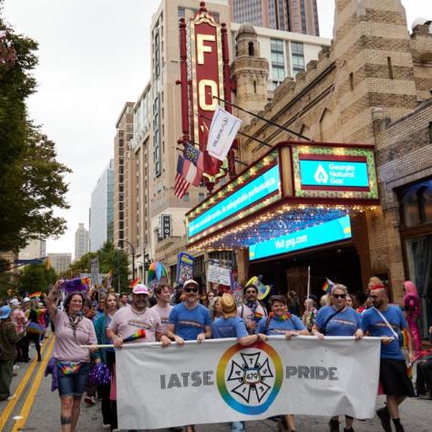 People marching in pride parade. 