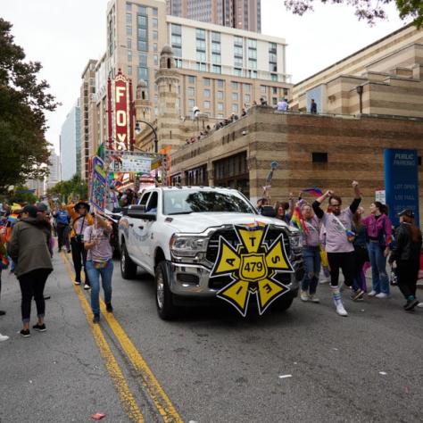 People marching in pride parade. 