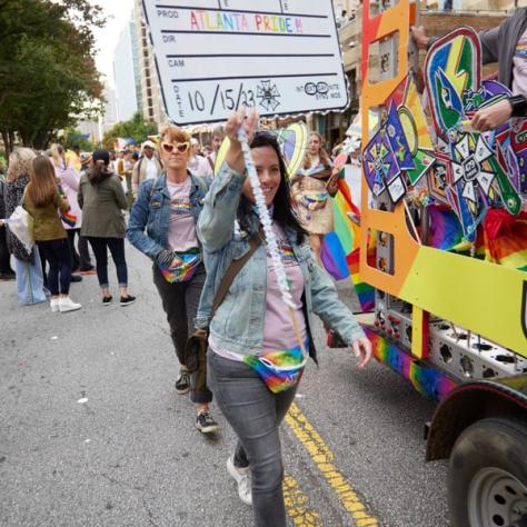 People marching in pride parade. 