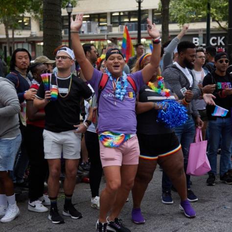 People marching in pride parade. 