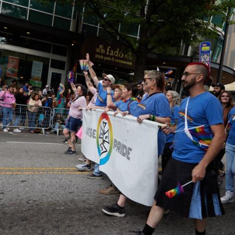 People marching in pride parade. 