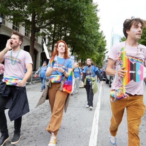 People marching in pride parade. 