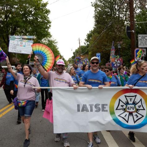 People marching in pride parade. 