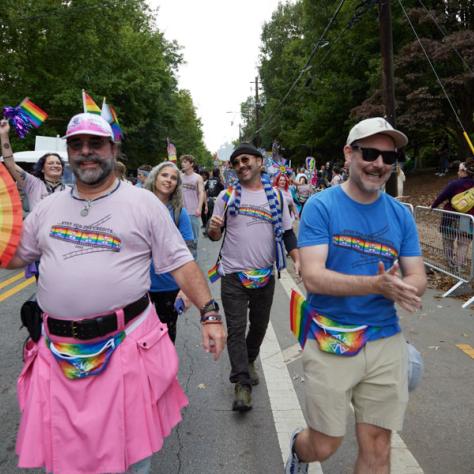 People marching in pride parade. 