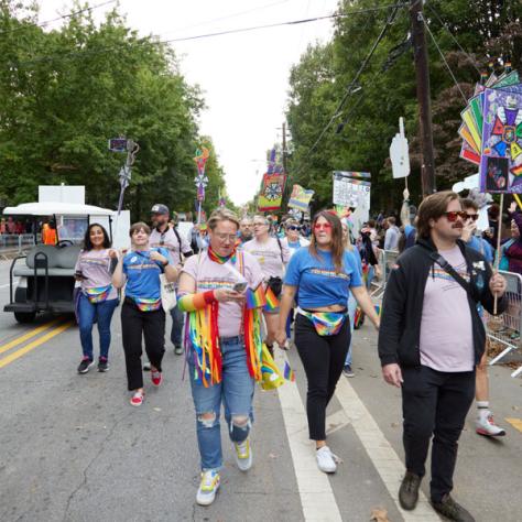 People marching in pride parade. 