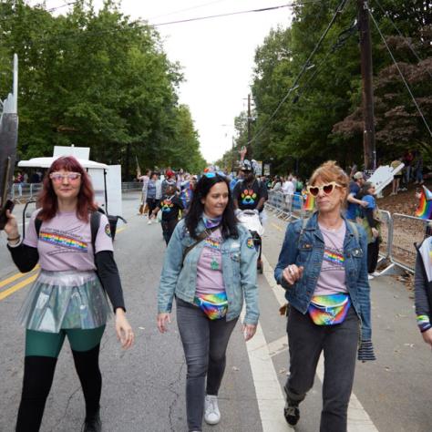 People marching in pride parade. 