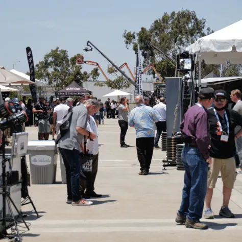 Outdoor view of people at expo. 