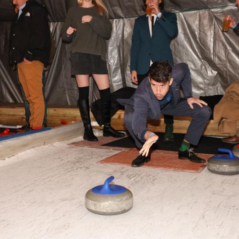 People playing shuffleboard. 