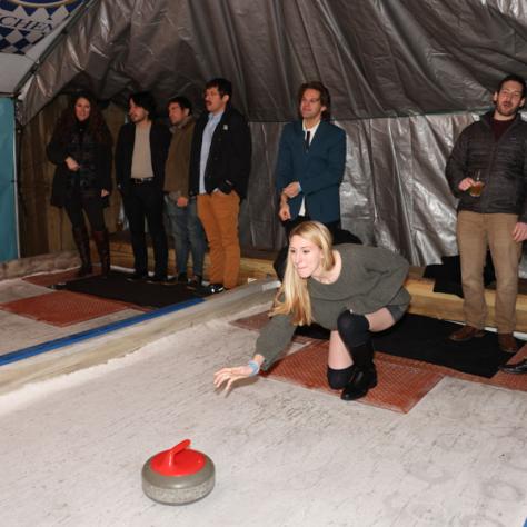 People playing shuffleboard. 